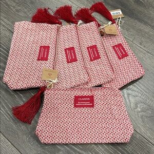 5/$20 Clarins Red Patterned Pouches with Tassels